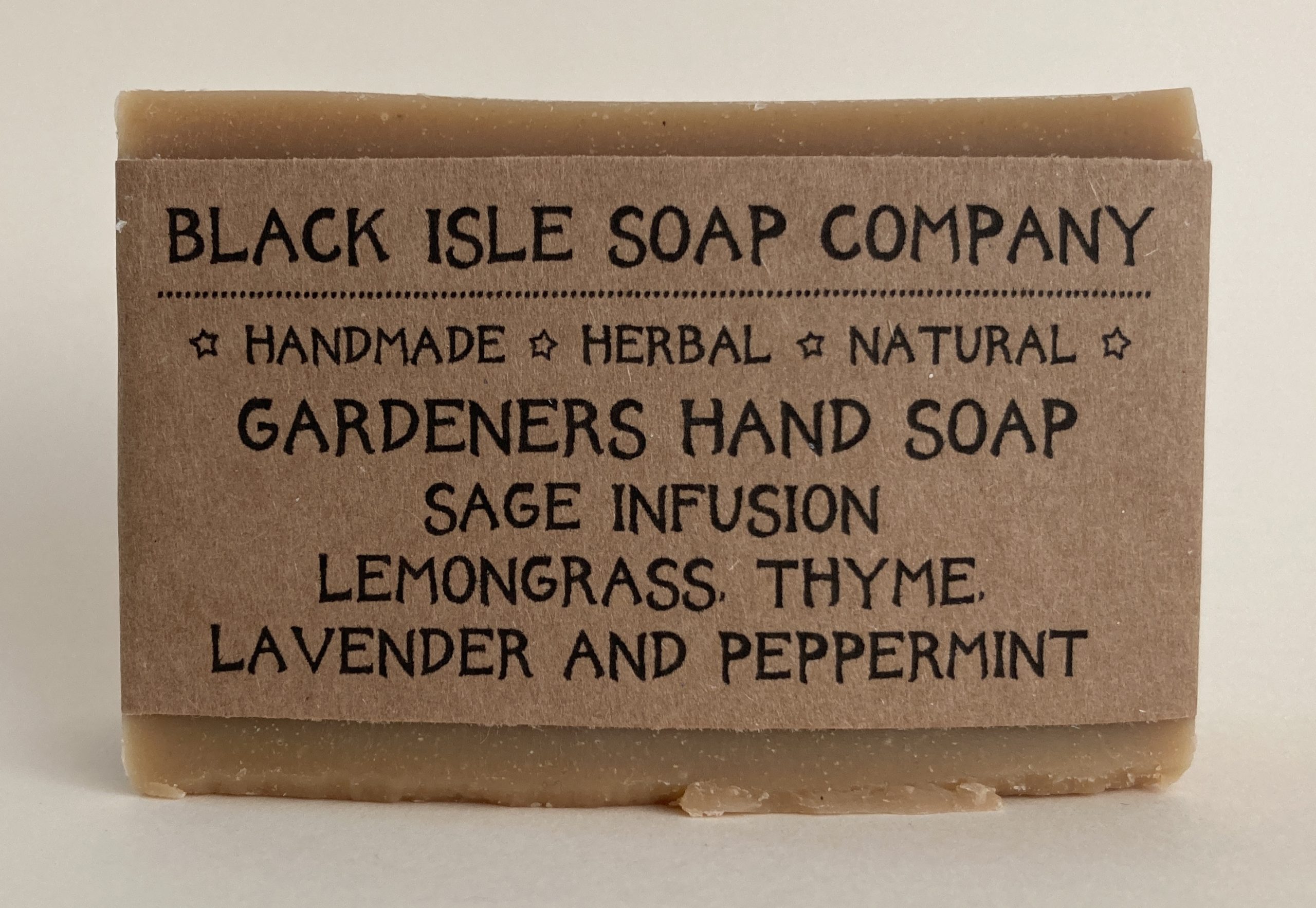 The Gardeners Hand Soap, scented with lemongrass, thyme, lavender and peppermint this soap bar has pumice added to scrub those green fingers clean. It is a deep browny orange coloured soap bar wrapped in brown paper